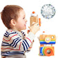Child playing with a wooden camera kaleidoscope toy featuring orange-ring lens and rainbow panels