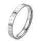 Polished narrow ring in silver tone, electroplated steel with engraved inner lettering.