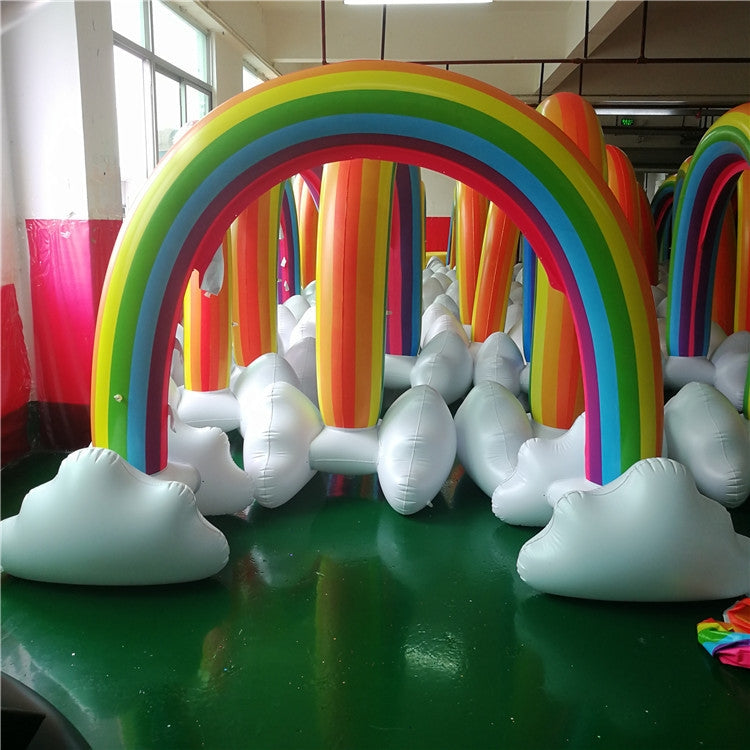 Inflatable rainbow arch sprinkler with white cloud bases and multicolor inflatable tube