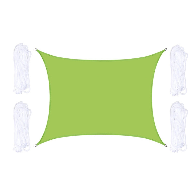 Green outdoor shade sail with corner grommets and white hanging ropes