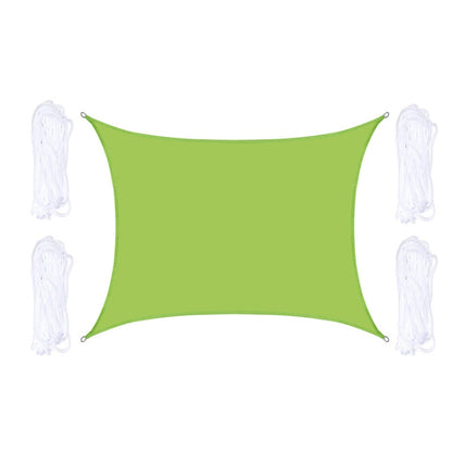 Green outdoor shade sail with corner grommets and white hanging ropes