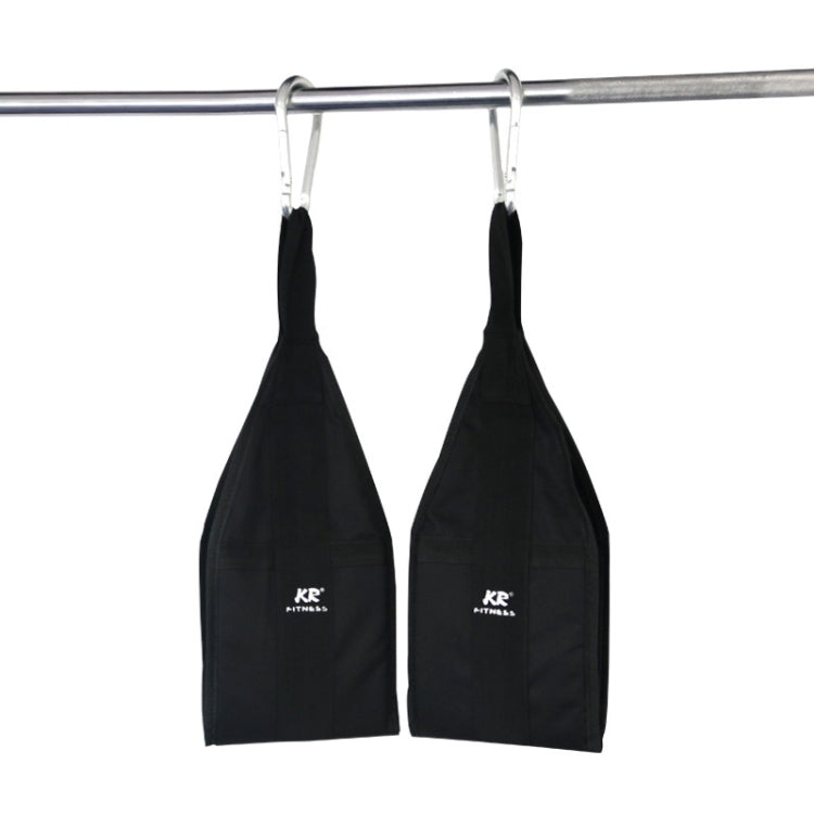 Black abdominal suspension belt pair hanging from a metal bar