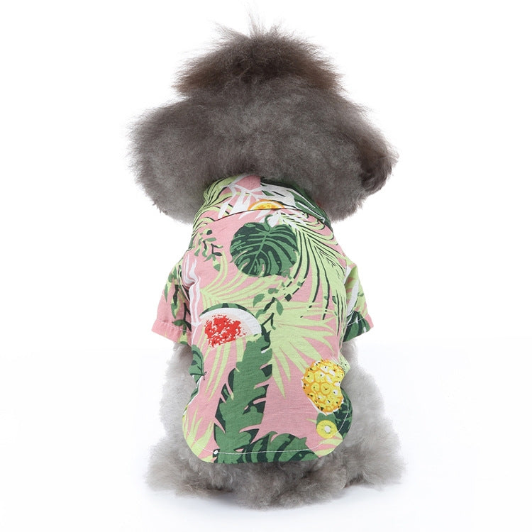 Dog beach shirt in pink, green, and yellow jungle leaf print with short sleeves