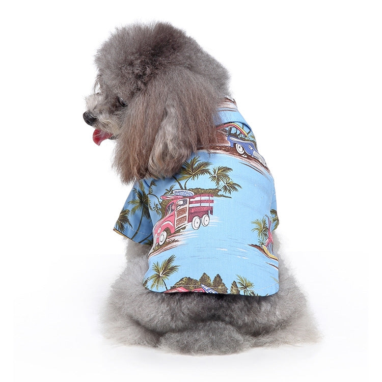 Dog summer shirt with train and palm print on light blue fabric.