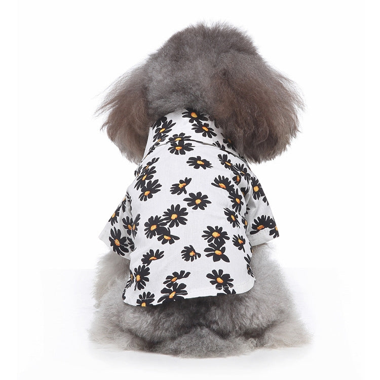 Dog summer shirt with daisy print on white fabric with black outlines.