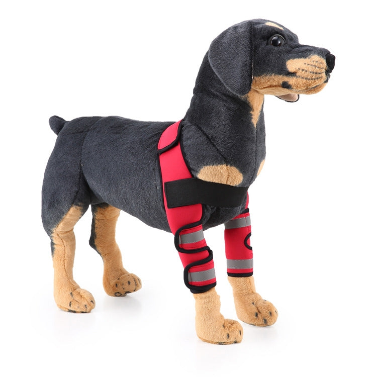 Dark gray plush dog knee guard with red leg wraps and black fastening straps
