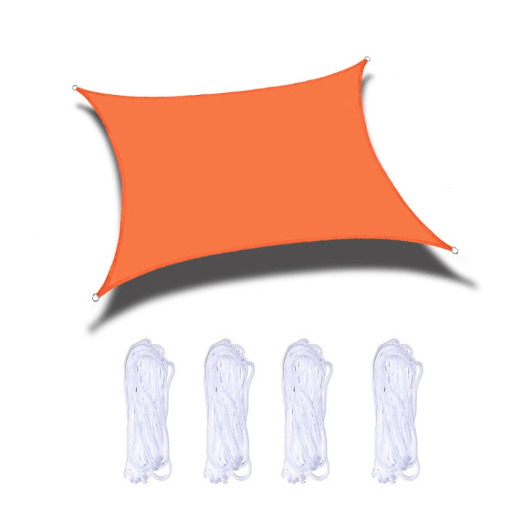 Orange waterproof shade sail with corner grommets and hanging ropes