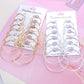 Gold- and silver-tone circle hoop earrings, 6 pairs total on two cards
