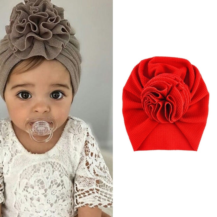 Baby turban hat in bright red with textured rosette flower, one size