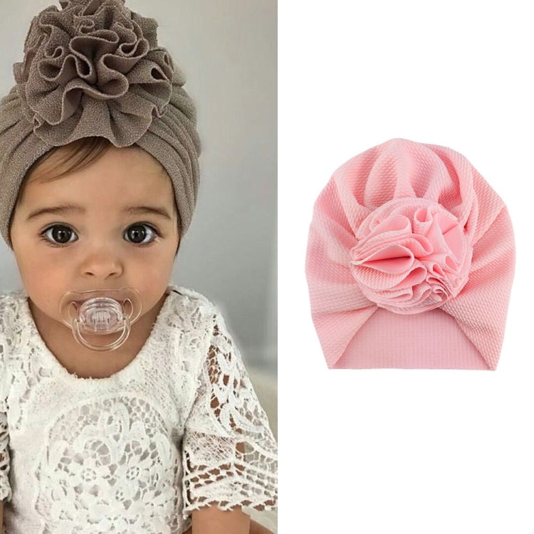 Baby turban hat in pale pink with textured rosette flower, one size