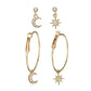 Gold-tone hoop earrings set with crescent moon and star drop charms, crystal accents