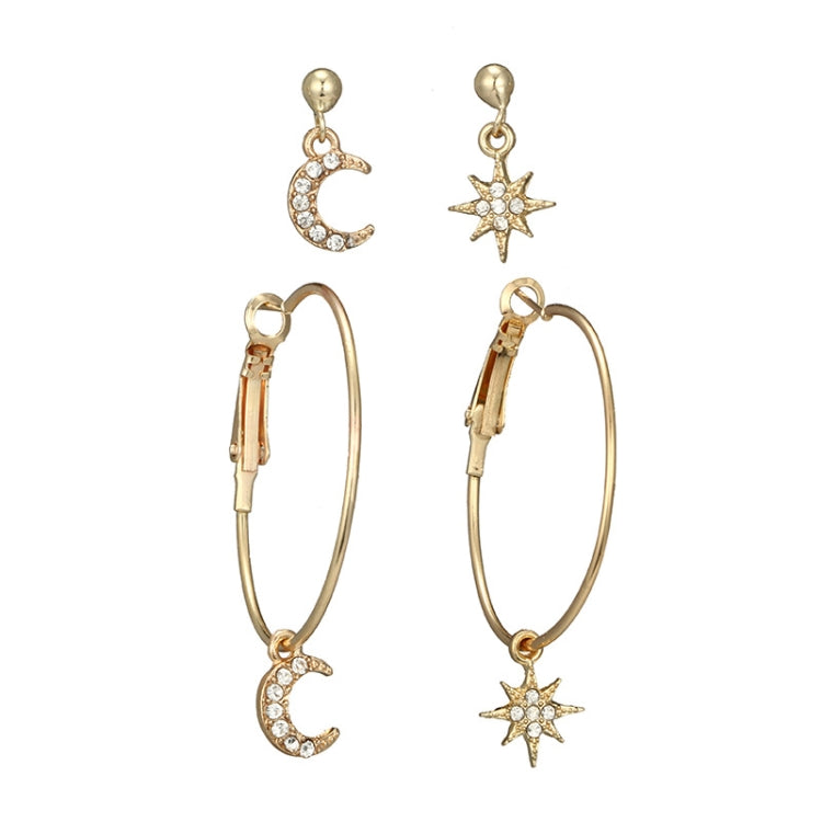 Gold-tone hoop earrings set with crescent moon and star drop charms, crystal accents