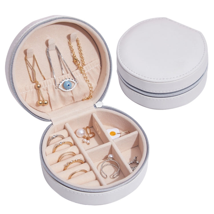 Round PU leather jewelry storage box, white exterior with pink-lined interior and compartments