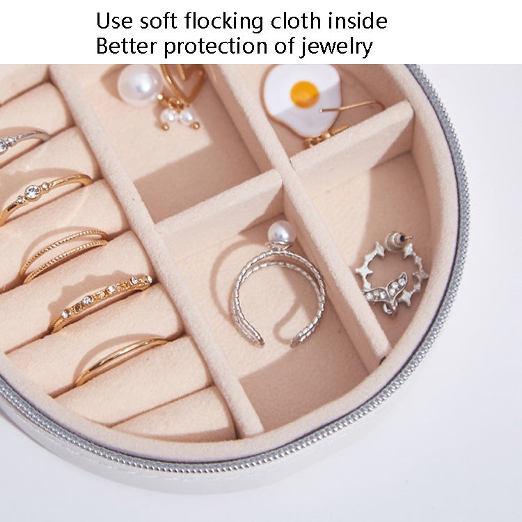 PU leather jewelry storage box interior with soft lining, dividers, and ring storage slots