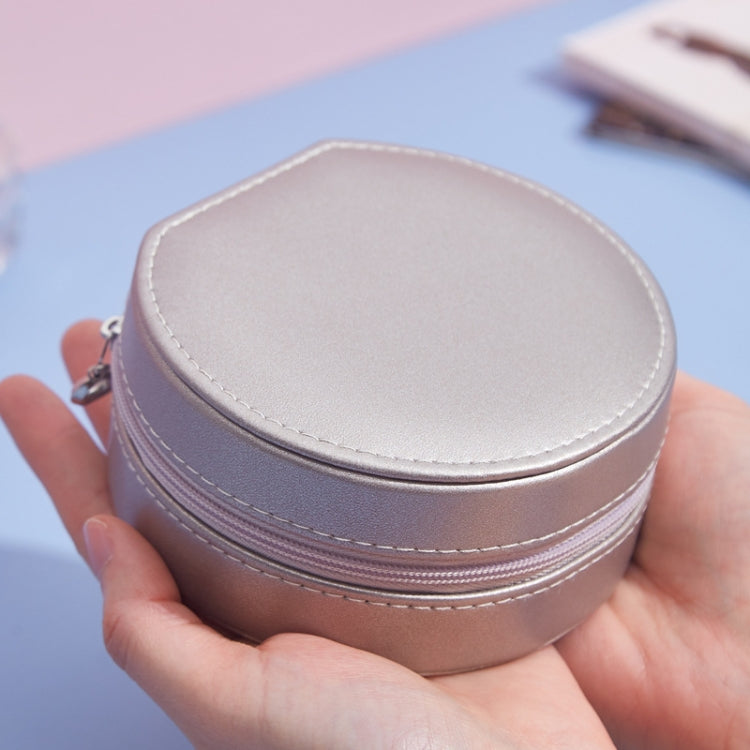 Round PU leather jewelry storage box lid, champagne gold exterior with stitched seams