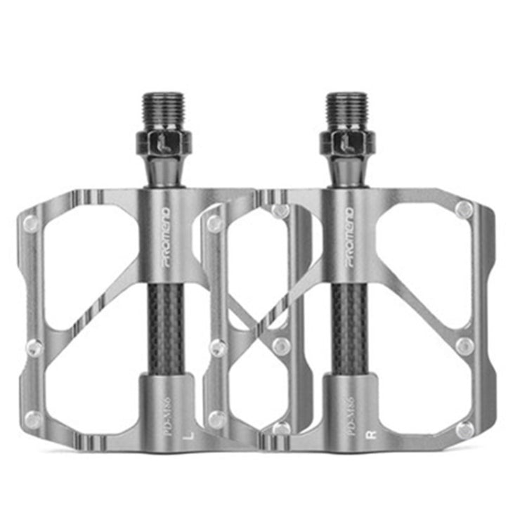 Silver carbon fiber bicycle platform pedals with threaded axle and large grip cutouts.