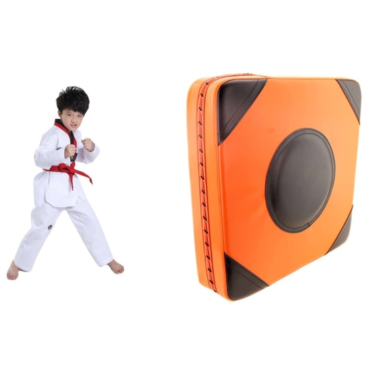 Orange and black boxing wall target with a gray oval striking pad on a square face