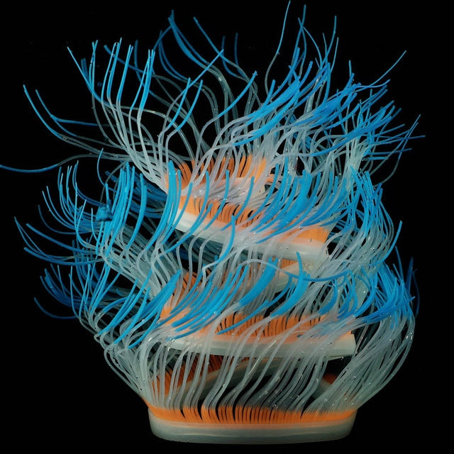 Fluorescent simulated coral anemone with bright blue tentacles and orange band accents