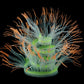 Fluorescent aquarium anemone decoration with orange tips and neon green center glow