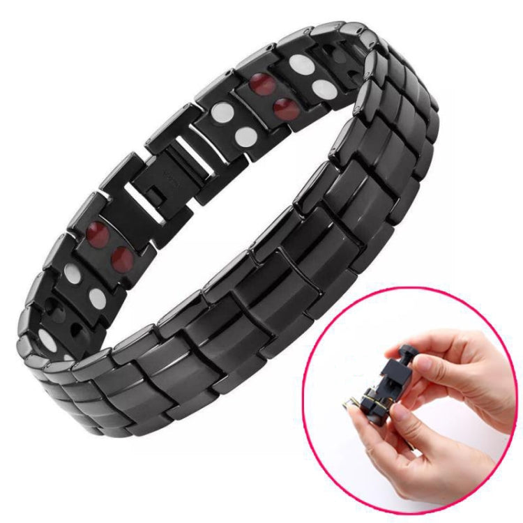 Black magnet bracelet with silver accent bars, red and white insets, and clasp detail