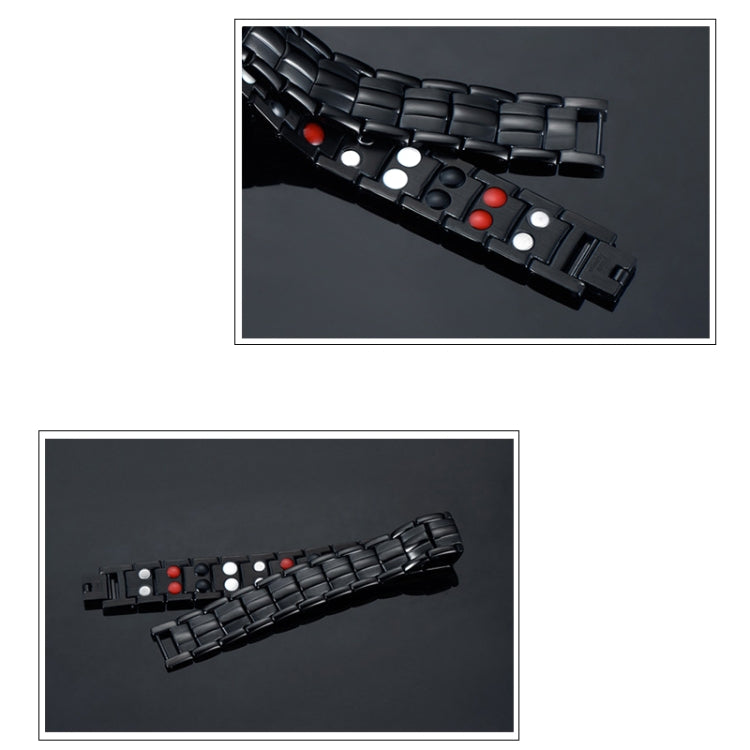 Black magnetic bracelet laid flat, showing linked metal plates and red magnet insets