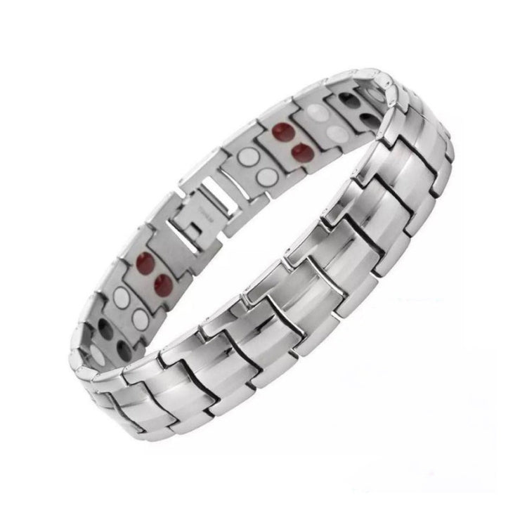 Silver-tone magnetic therapy bracelet with linked metal bands and red and white inset magnets