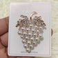 Grape pearl rhinestone brooch on jewelry card, rose-gold tone