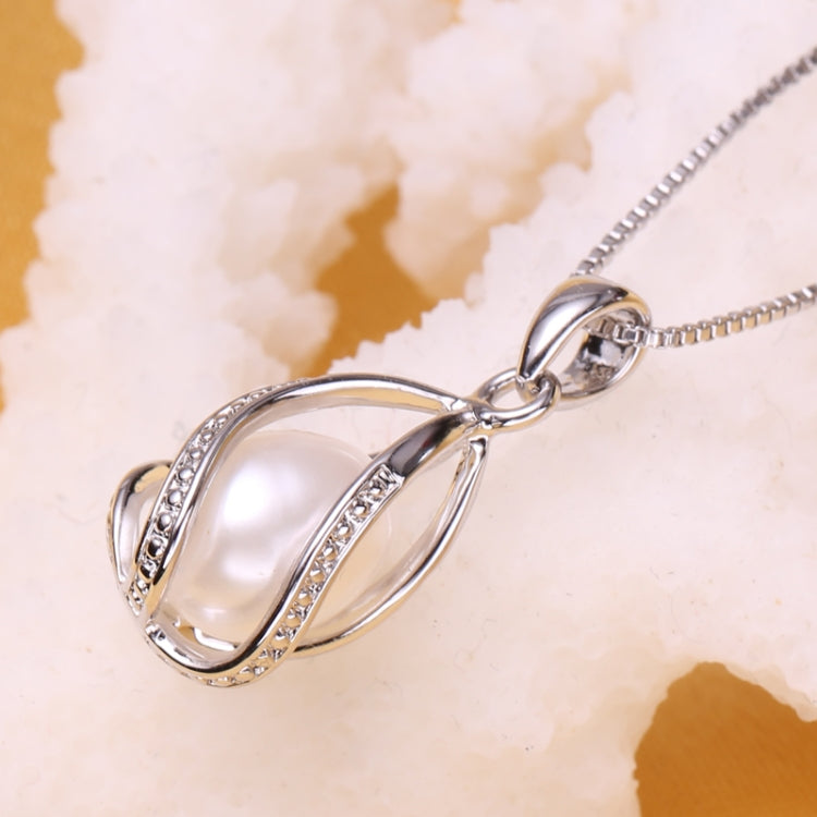 Silver-tone oval cage pendant with natural pearl and rhinestone inlay
