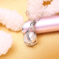 Silver-tone teardrop cage pendant with natural pearl and rhinestone trim on chain