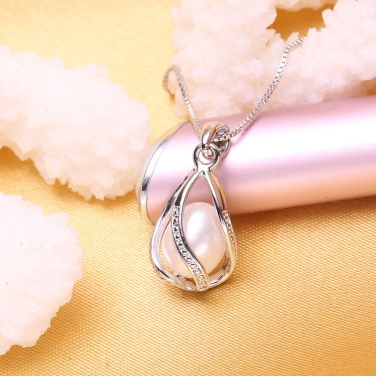 Silver-tone teardrop cage pendant with natural pearl and rhinestone trim on chain