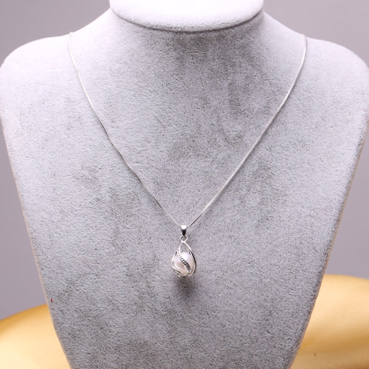 Silver-tone teardrop cage pendant necklace on a mannequin