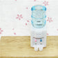 Miniature water dispenser toy, white body with blue reservoir and two colored taps