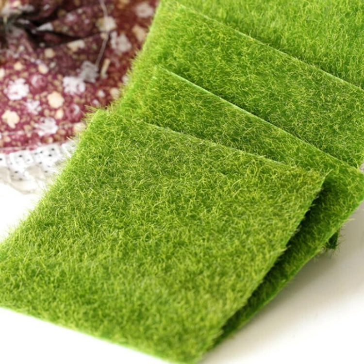 Close-up of bright green artificial turf mat with overlapping edge layers
