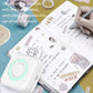 Mini thermal Bluetooth printer with mint green ring, beside printed document pages