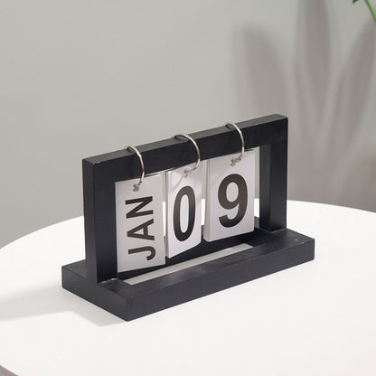 Wooden flipping desk calendar with black frame, metal rings, cards showing JAN 09