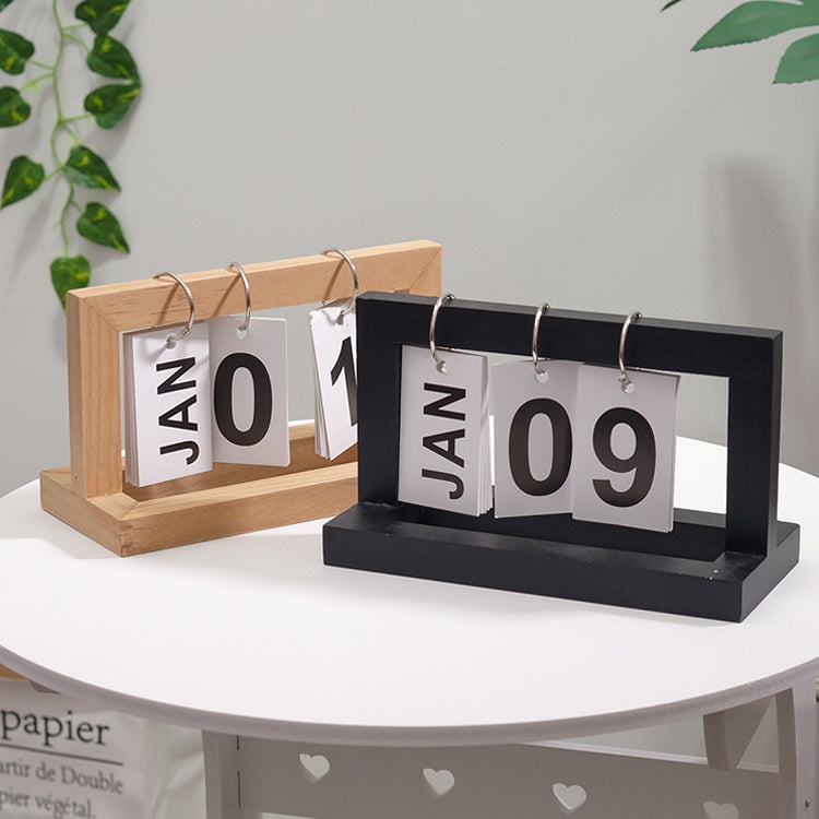 Wood and black flipping desk calendars with metal rings, cards showing JAN 01 and JAN 09