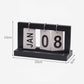 Black wooden flipping desk calendar with metal rings, cards showing JAN 08