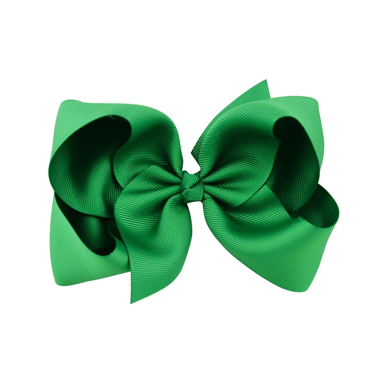 Green layered ribbon hair bow clip with double-loop bow center knot.