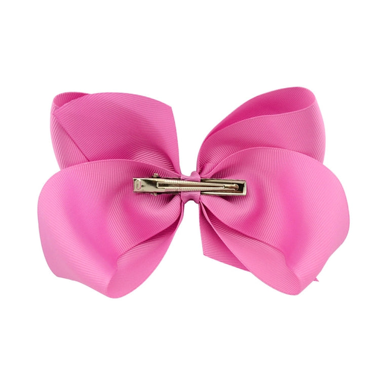 Pink layered ribbon hair bow clip with metal snap bar and double-loop center knot.