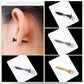 Black star screw stud earrings on an ear, with straight posts.