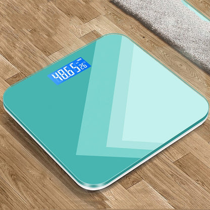 Teal smart electronic bathroom scale with blue digital LCD display on top glass