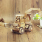 Wooden model excavator toy ornament with cab, tracks, and front bucket, light wood