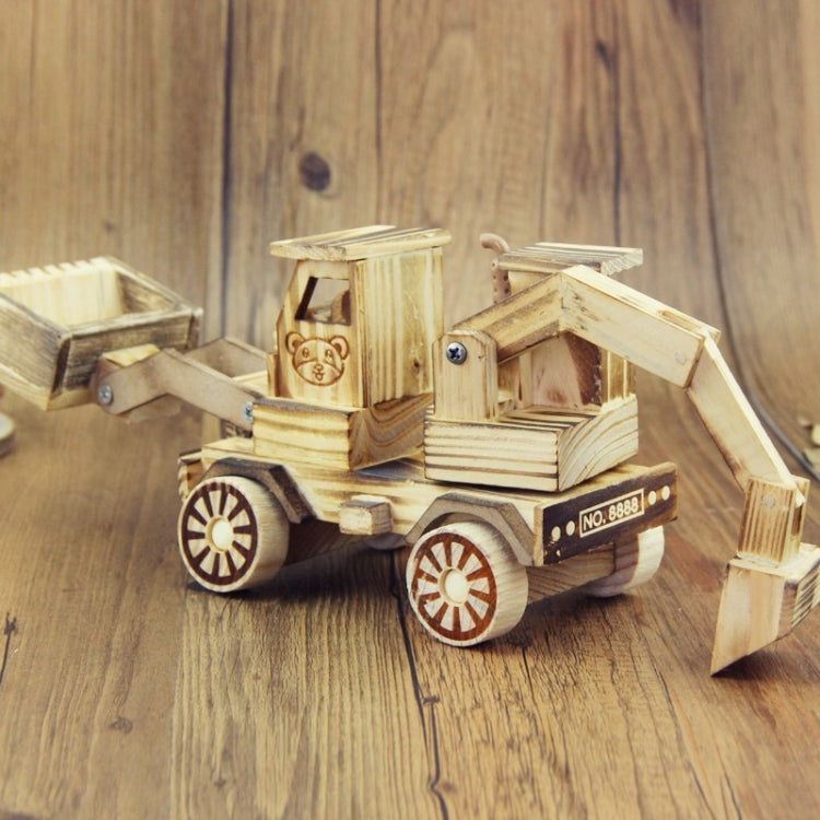 Wooden model excavator toy ornament with detailed cab, wheels, and raised arm, light wood
