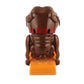 Brown poodle novelty trick toy front view with orange base and open mouth