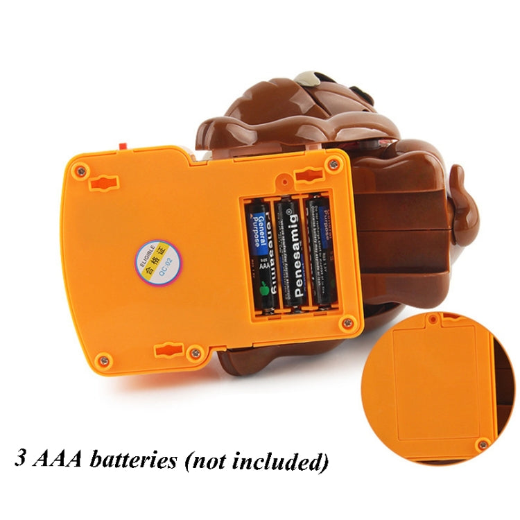 Orange battery compartment on poodle trick toy; 3 AAA batteries not included
