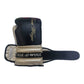 Black half-finger boxing glove with beige wrist strap and gold logo