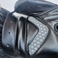 Black half-finger glove close-up with textured breathable side panel