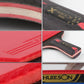 Close-up of table tennis racket handle and red rubber surface detail