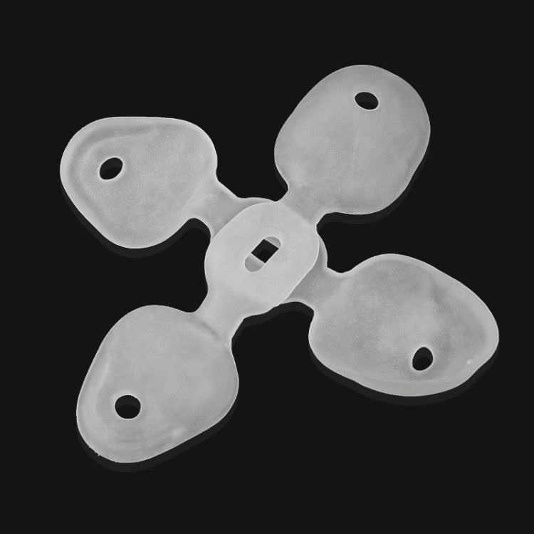 Set of white SEBS hallux valgus corrector pads with toe separators and holes
