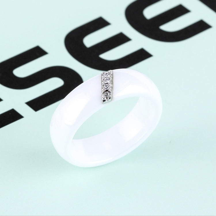 White ceramic ring close-up with rectangular zircon crystal inlay